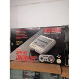 Super Nintendo console with original box.