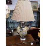 Modern contemporary table lamp in ornate design.