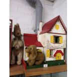 Retro 1950s dolls house together with teddies.
