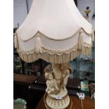 Large cherub s table lamp with shade.