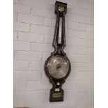 Large antique barometer with mother of pearl inlays.