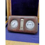 Travelling clock/ pocket watch with barometer in fitted leather casing.