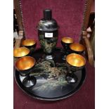 Oriental lacquered cocktail shaker set with matching goblets and tray with pagoda gilt design..