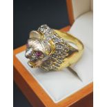 Ornate large lion head ring.