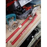 Pipe bending tool together with blue handled power tool.