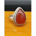 Silver ring set in Amber style setting.