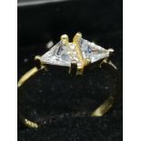 Silver 925 ring on gilt with clear stones.