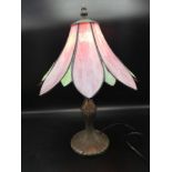 Tiffany style lily pad shaded table lamp in the bronze effect.