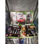 Shelf of xbox 360 games.