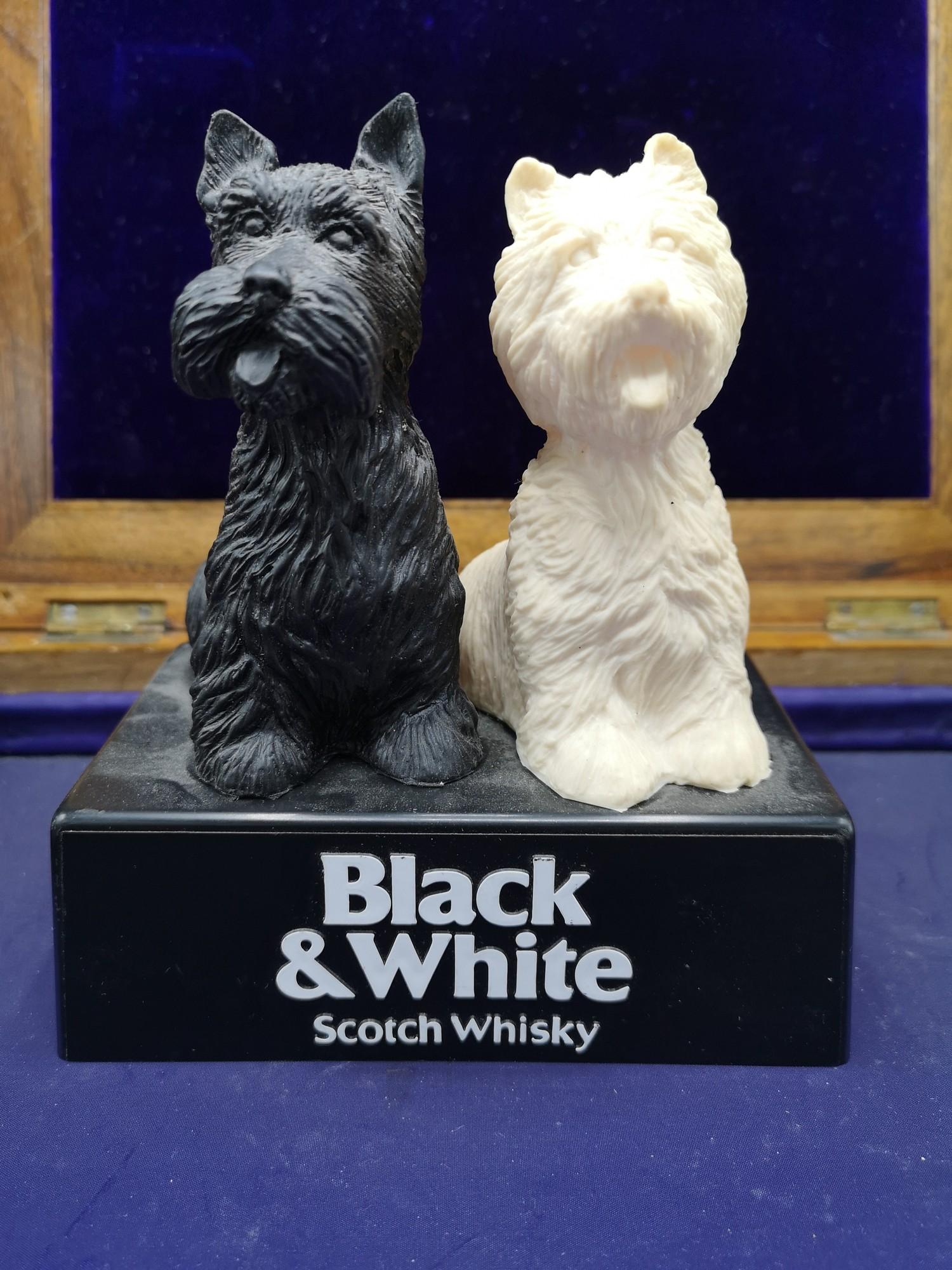 Black and white scotch whisky adverting items.