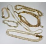 Lovely collection of pearl necklaces and bracelets.