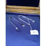 2 pairs of silver Hall marked georgian tongs.