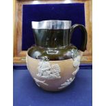 Early Royal doulton lambeth ware jug with silver Hall marked metal rim.
