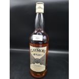 Bottle of Claymore blended scotch whisky 1 litre full and sealed.