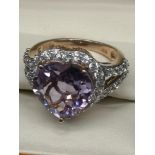 Stunning silver ring with heart shape style setting.