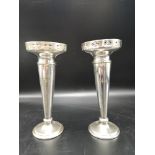 Pair of silver plated bud vases in ornate design.