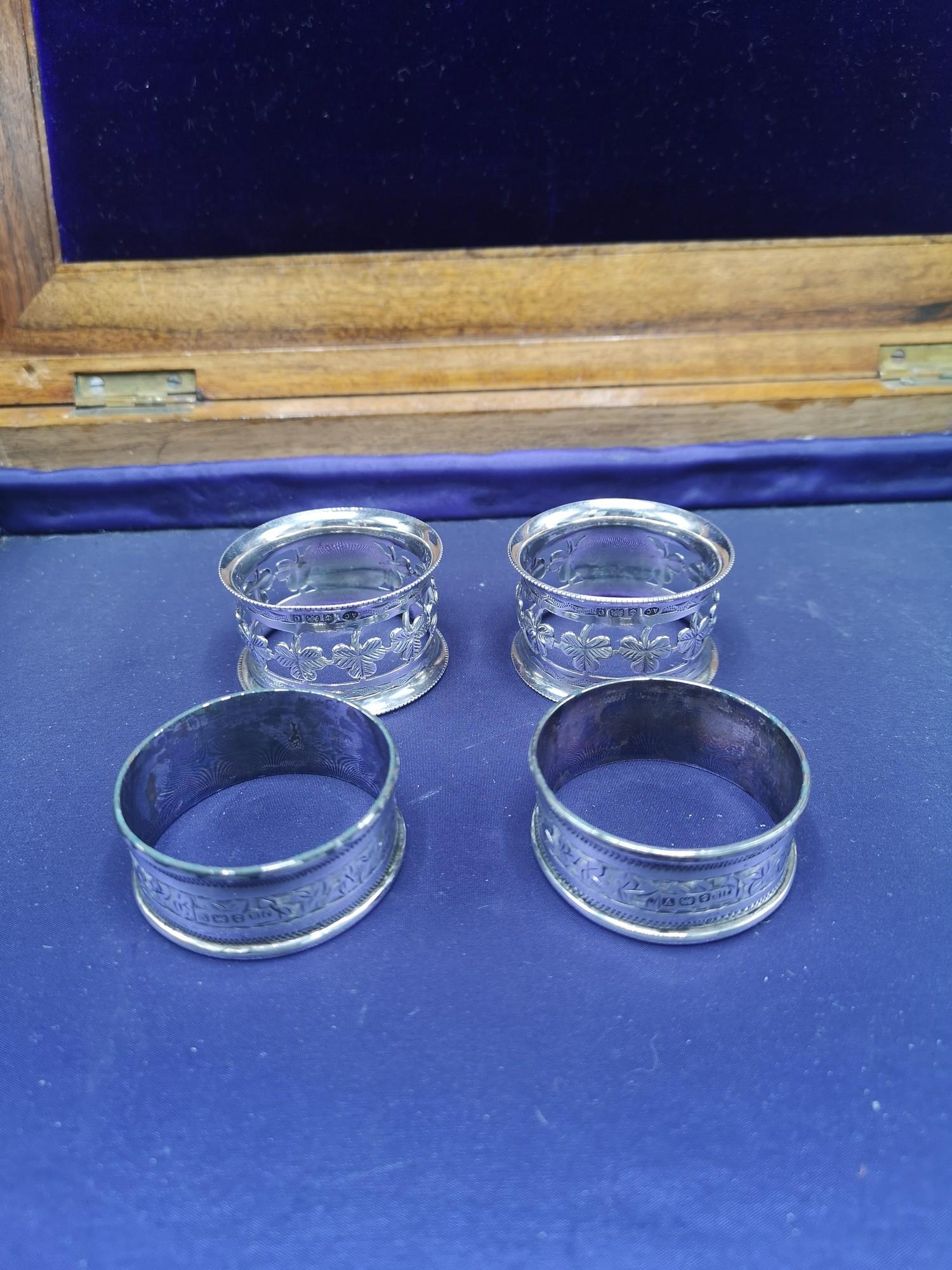 2 pairs of silver napkin rings including Irish.