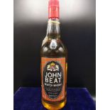 Bottle of John beat scotch whisky. 100cl. Full and sealed.