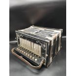 Antique musicians squeeze box with inlays.