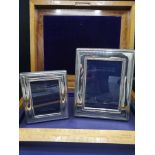 2 sterling silver photo frames.