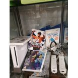 Nintendo wii console with games.