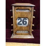 Antique 1900s desk calendar in working order.