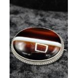 Large tiger eye style brooch.