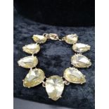 Yellow stones large pear shapes antique setting bracelet.
