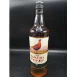Bottle of The famous grouse scotch whisky 1 litre full and sealed.