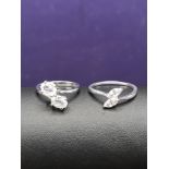 2 Silver Crossover Rings set in Cubic Zirconia Stones. Sizes N & half. size S.