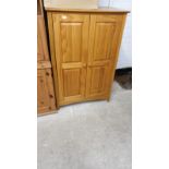 Pine 2 door Childs wardrobe.50 Inches Height x33 Inches Length x 20 Inches Depth.