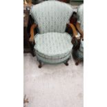 Pair of Antique style arm chairs with green upholstery.