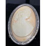 Large marked silver rimmed cameo 2 inches in length.