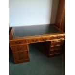 Large Reproduction double section writing desk with leathered top.