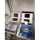 2 nintendo ds s and games. Not tested.
