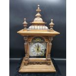 Large oak victorian clock with brass facing. Needs attention on top column. Needs pendulum.