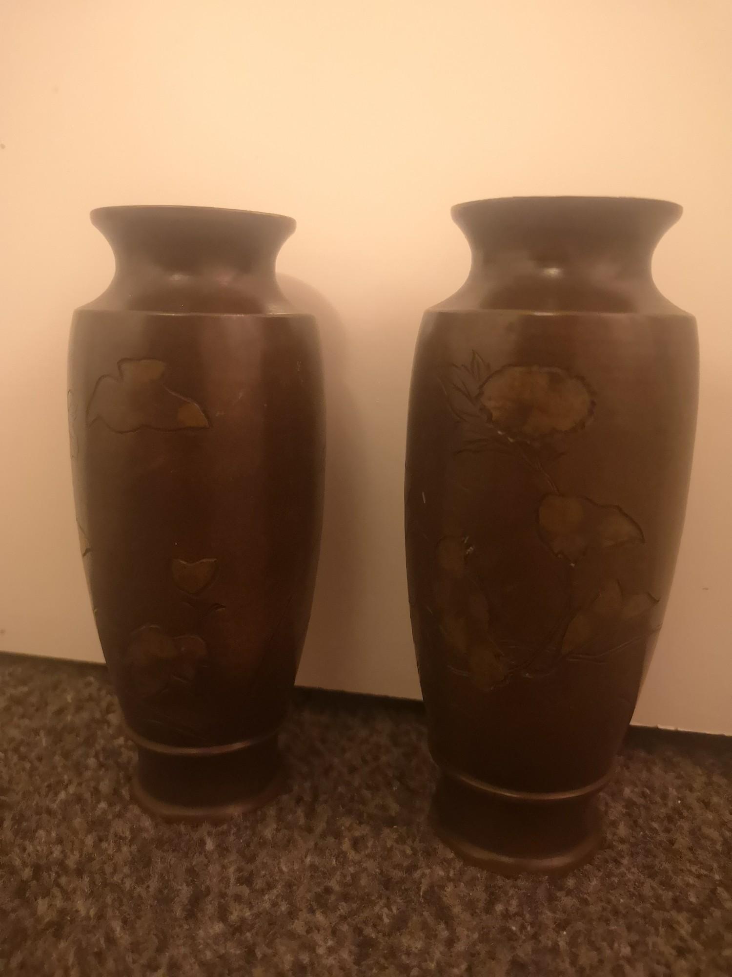 Pair of japenese bronze vases depicting flower design..