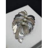 Silver Hall marked birmingham brooch set with seed pearl setting. Makers wbs.
