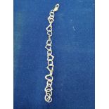 Silver hall marked bracelet with stylised heart links . 7.5 inches in length , weighs 17.5 grams .