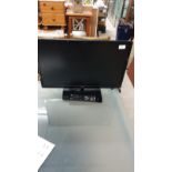 Logik flat screen TV with remote.