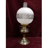 Vintage oil lamp with glass shade.