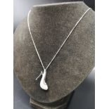 Silver chain with silver diamonte shoe silver pendant.