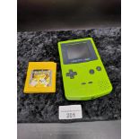Gameboy color in green Together with pokemon yellow.