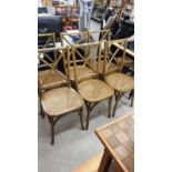 Set of 6 bent wood chairs with rattan upholstery.