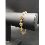 Vintage Silver bracelet set in baltic amber .