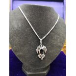 Vintage Silver Goth style pendant set with black oynx on a 22 inch silver curb chain stamped 925 .
