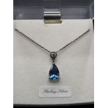Silver 925 necklace with silver 925 marked blue stone pendant.