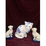 Pair of Reproduction dog figures together with large cat figure.