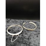 2 White metal bangles one marked 925.