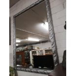 Large silver coloured framed mirror.